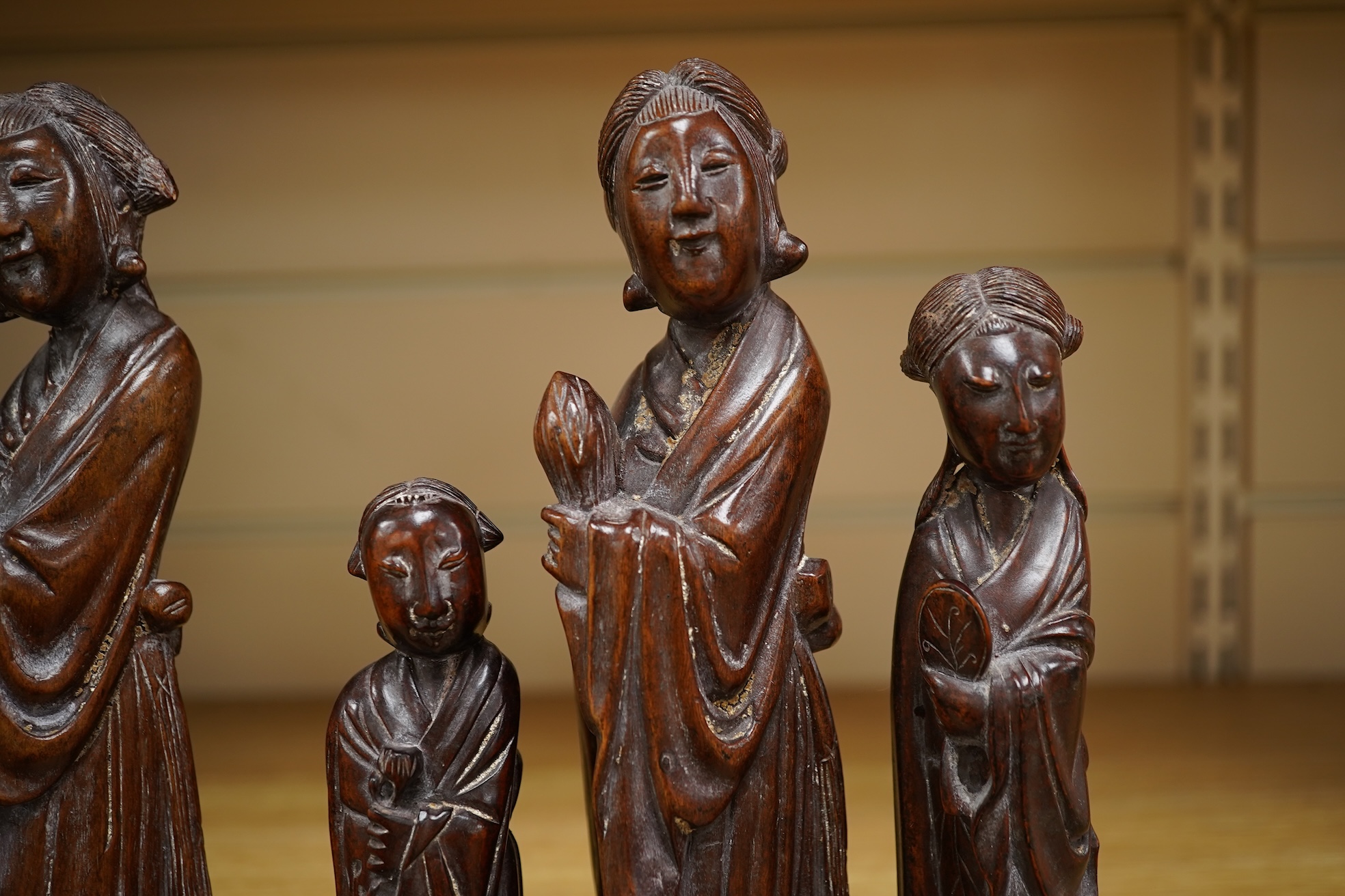 Six mid 20th century Chinese carved wood figures holding lotus and a Cultural Revolution carving of turin girls (7) tallest 21cm